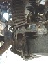 Driver's side shock covering and suspension